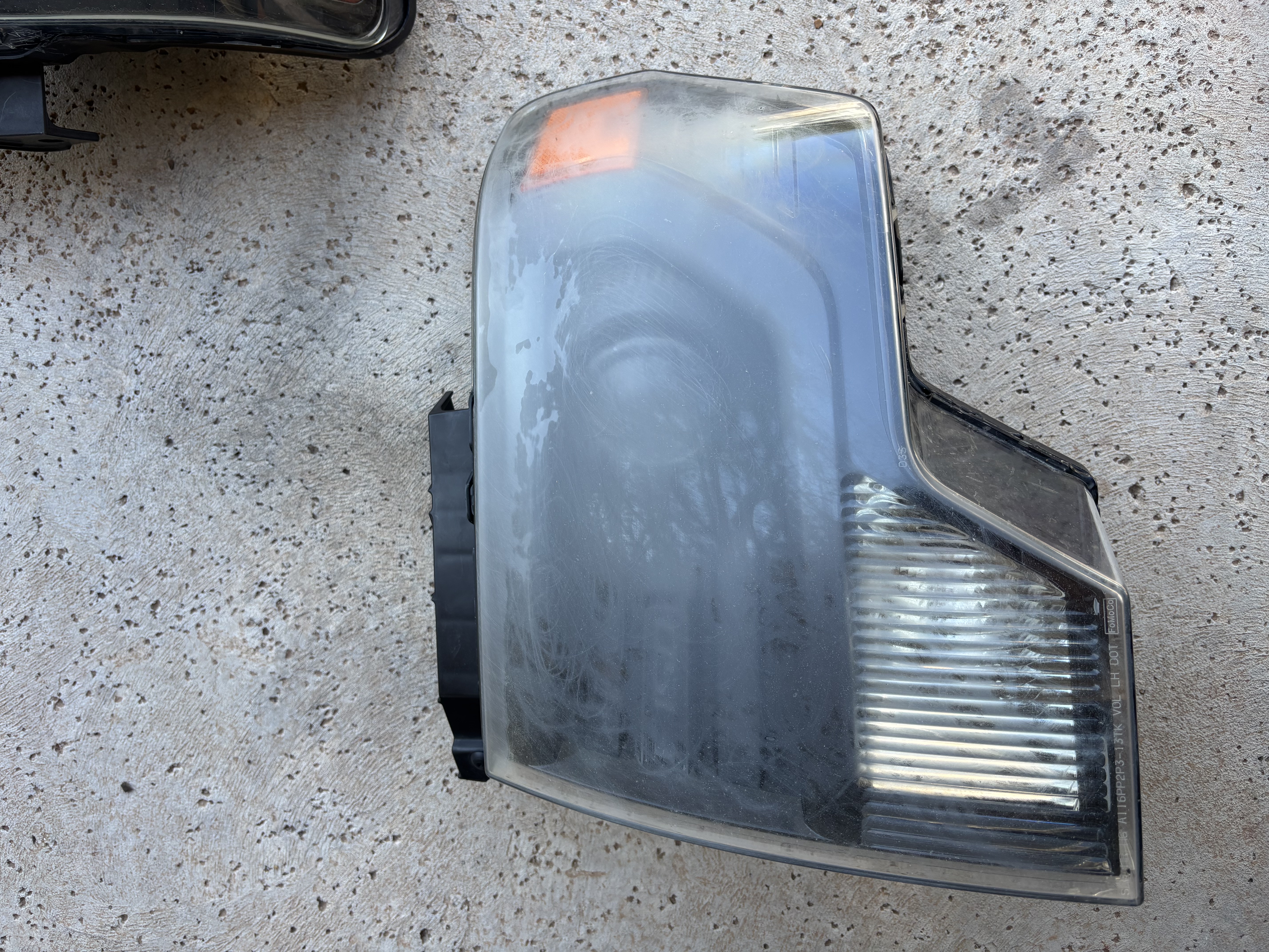 Foggy yellowed headlight before restoration